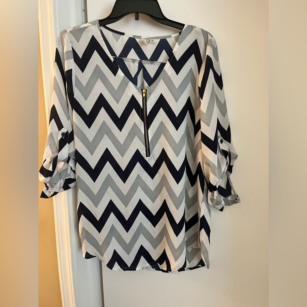 Great blouse with zipper front.